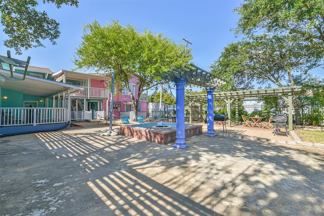 1513 19th St, Galveston, TX 77550 - view of property's community with a pergola and a patio