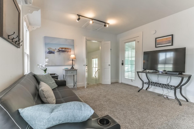 1513 19th St, Galveston, TX 77550 - carpeted living area with baseboards