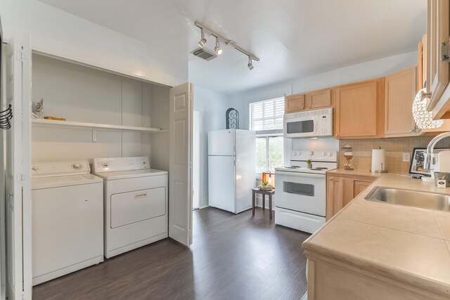 1513 19th St, Galveston, TX 77550 - kitchen with white appliances, light brown cabinetry, washer and dryer, a sink, and open shelves