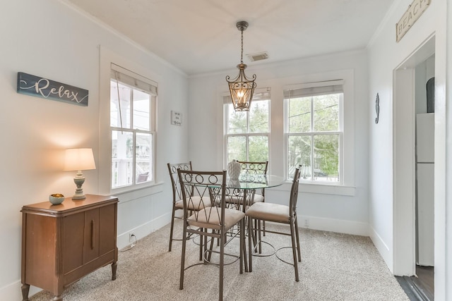 1513 19th St, Galveston, TX 77550 - dining area with ornamental molding, carpet flooring, and baseboards