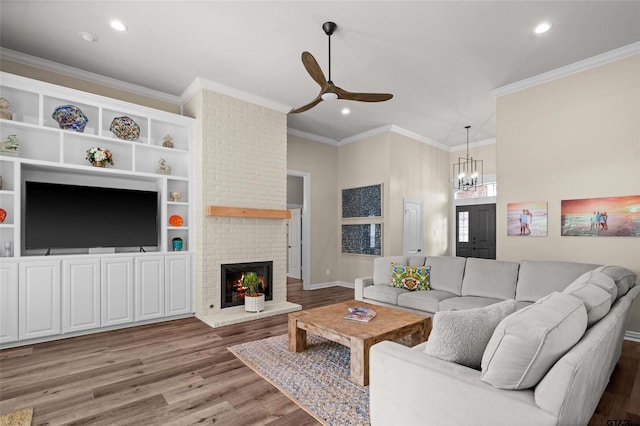 420 Bunker Dr, Tyler, TX 75703 - living area featuring light wood-type flooring, recessed lighting, a chandelier, a ceiling fan, and crown molding
