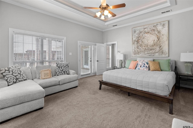 420 Bunker Dr, Tyler, TX 75703 - carpeted bedroom featuring a tray ceiling, ornamental molding, access to exterior, and ceiling fan