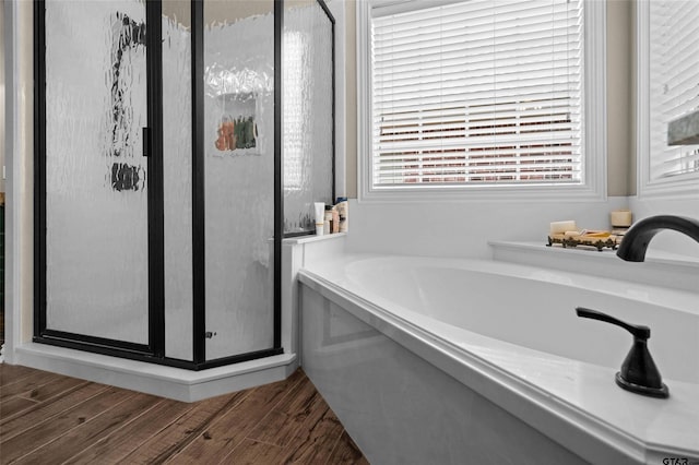 420 Bunker Dr, Tyler, TX 75703 - full bathroom featuring a shower stall, a bath, and wood finished floors