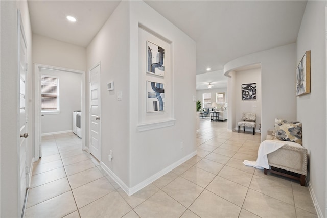 6531 Cody Mountain Trl, Richmond, TX 77407 - hall with light tile patterned floors, recessed lighting, baseboards, and washer / clothes dryer