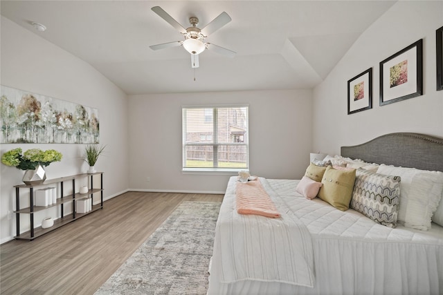 6531 Cody Mountain Trl, Richmond, TX 77407 - bedroom with lofted ceiling, light wood-style flooring, and baseboards
