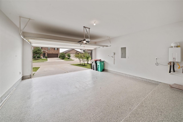 6531 Cody Mountain Trl, Richmond, TX 77407 - garage featuring electric panel, tankless water heater, a garage door opener, and baseboards
