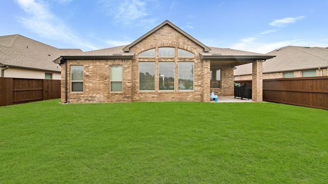 5903 Red River Dr, Manvel, TX 77578 - rear view of house featuring brick siding, a patio area, and a shingled roof