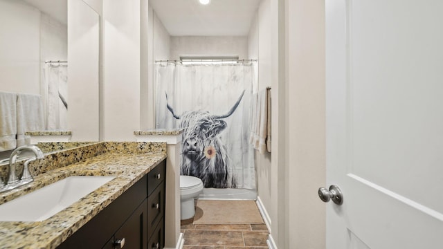 5903 Red River Dr, Manvel, TX 77578 - bathroom featuring toilet, vanity, baseboards, and a shower with shower curtain