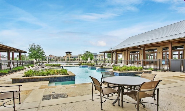 10506 Star Thistle Ct, Cypress, TX 77433 - community pool with a patio
