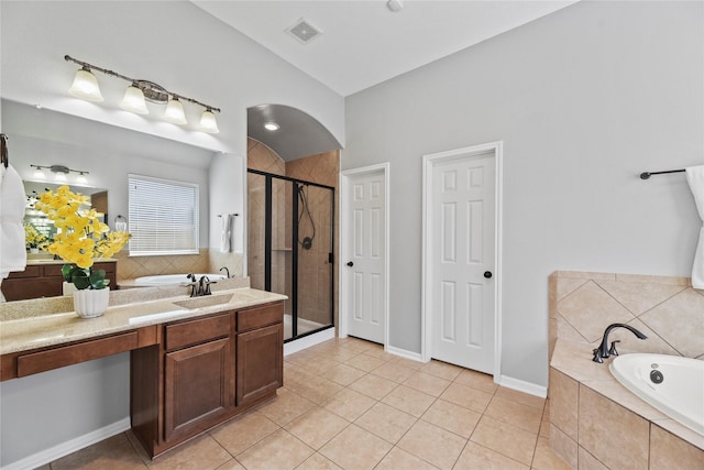 10506 Star Thistle Ct, Cypress, TX 77433 - full bathroom featuring a bath, tile patterned floors, a stall shower, vanity, and lofted ceiling
