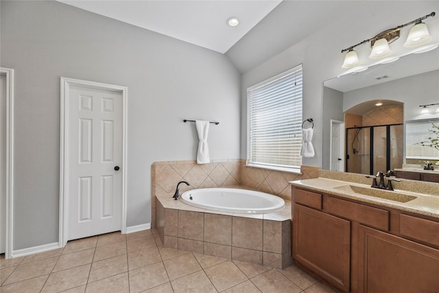 10506 Star Thistle Ct, Cypress, TX 77433 - bathroom with vanity, a bath, tile patterned floors, a stall shower, and lofted ceiling