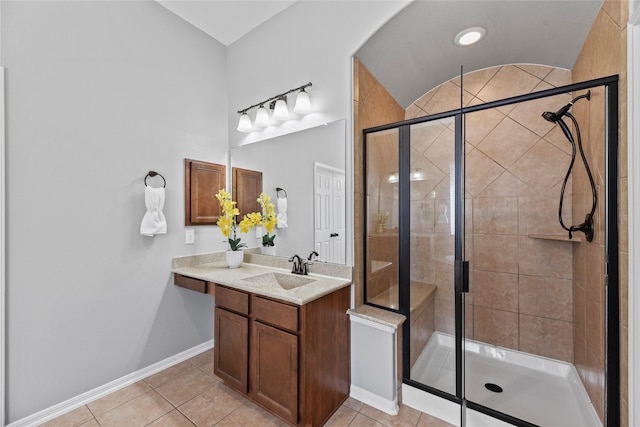 10506 Star Thistle Ct, Cypress, TX 77433 - full bathroom with a shower stall, tile patterned floors, vanity, baseboards, and lofted ceiling
