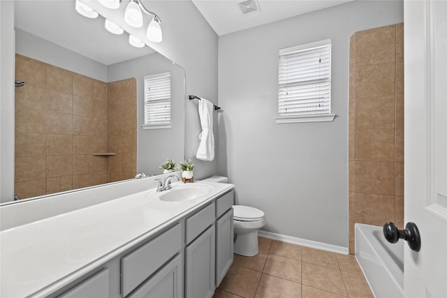 10506 Star Thistle Ct, Cypress, TX 77433 - full bathroom with vanity, toilet, tile patterned flooring, tub / shower combination, and baseboards