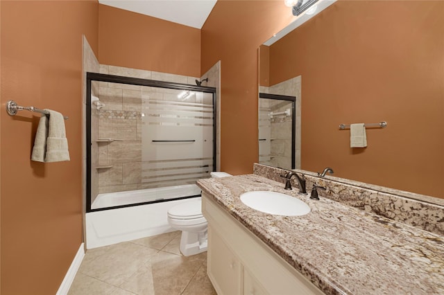 2005 Mistwood Ct, Pearland, TX 77584 - full bath with toilet, vanity, combined bath / shower with glass door, tile patterned flooring, and baseboards