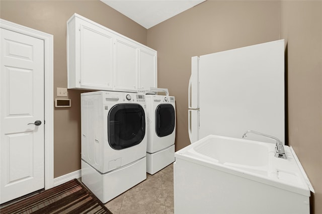2005 Mistwood Ct, Pearland, TX 77584 - washroom with washing machine and dryer, cabinet space, and baseboards
