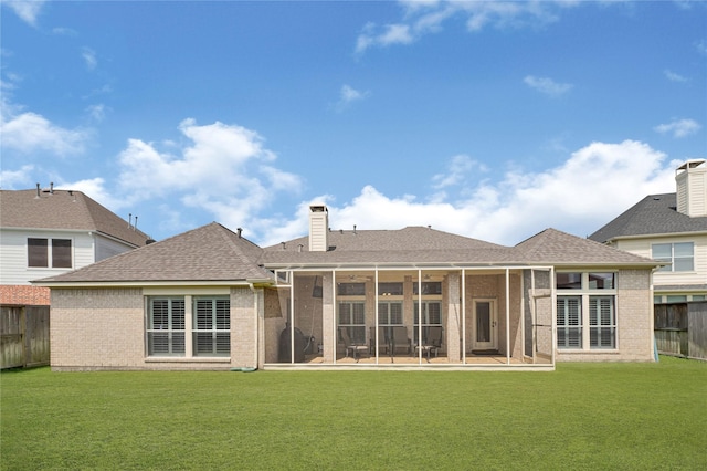 2005 Mistwood Ct, Pearland, TX 77584 - rear view of property featuring a sunroom, brick siding, and a chimney