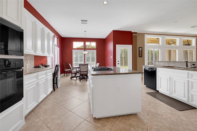 2005 Mistwood Ct, Pearland, TX 77584 - kitchen featuring black appliances, a sink, backsplash, white cabinets, and recessed lighting
