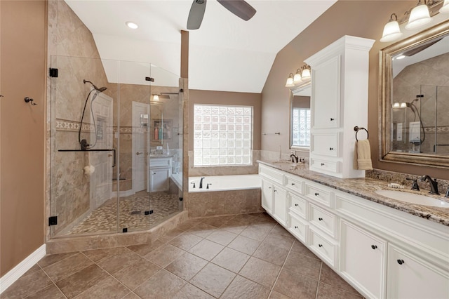 2005 Mistwood Ct, Pearland, TX 77584 - full bath featuring double vanity, a bath, a shower stall, ceiling fan, and lofted ceiling
