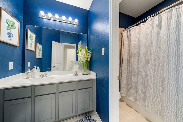 77 Indian Wells Dr, Manvel, TX 77578 - bathroom with a textured wall, vanity, and tile patterned flooring