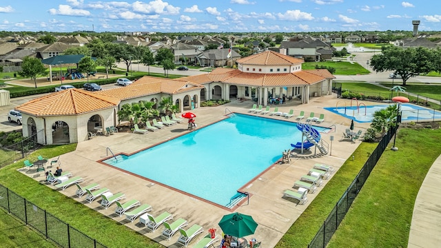 77 Indian Wells Dr, Manvel, TX 77578 - community pool with a residential view and a patio