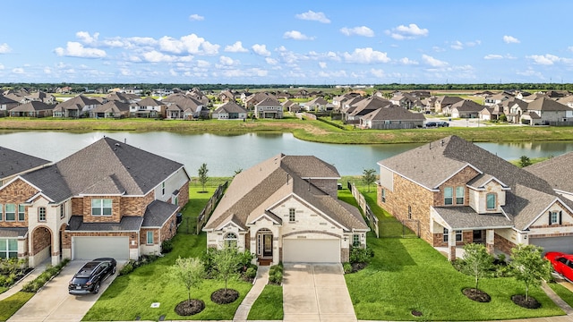 77 Indian Wells Dr, Manvel, TX 77578 - aerial view of residential area featuring a nearby body of water