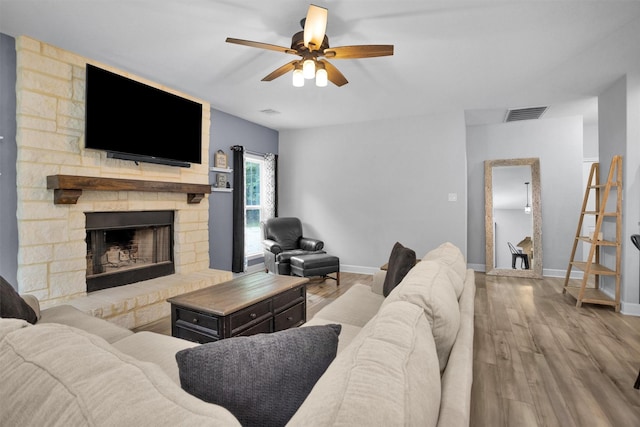 4142 Longhorn Dr, Cleveland, TX 77328 - living room featuring wood finished floors, ceiling fan, and a fireplace