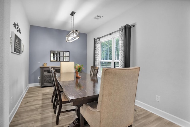 4142 Longhorn Dr, Cleveland, TX 77328 - dining room featuring light wood-style floors and a chandelier