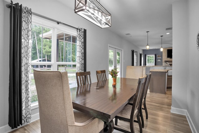 4142 Longhorn Dr, Cleveland, TX 77328 - dining area with light wood-style floors and baseboards