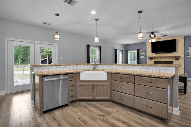 4142 Longhorn Dr, Cleveland, TX 77328 - kitchen with stainless steel dishwasher, light wood-type flooring, a ceiling fan, pendant lighting, and recessed lighting