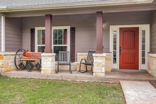 4142 Longhorn Dr, Cleveland, TX 77328 - entrance to property with covered porch, stone siding, and roof with shingles