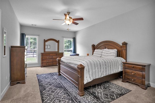 4142 Longhorn Dr, Cleveland, TX 77328 - carpeted bedroom with multiple windows and a ceiling fan
