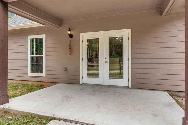 4142 Longhorn Dr, Cleveland, TX 77328 - property entrance with french doors and a patio area