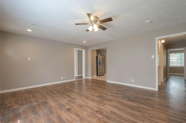 3915 Florinda St, Houston, TX 77021 - unfurnished room featuring ceiling fan, baseboards, wood finished floors, and recessed lighting