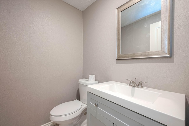 3915 Florinda St, Houston, TX 77021 - bathroom with toilet, vanity, and a textured wall