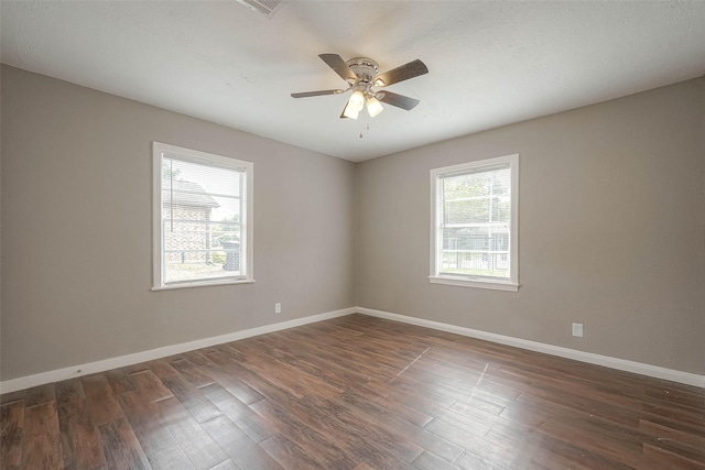 3915 Florinda St, Houston, TX 77021 - unfurnished room featuring plenty of natural light, dark wood-style flooring, and baseboards