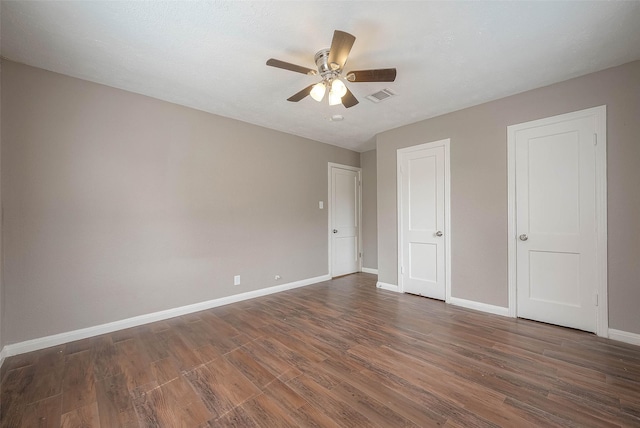 3915 Florinda St, Houston, TX 77021 - unfurnished bedroom with wood finished floors, baseboards, and ceiling fan