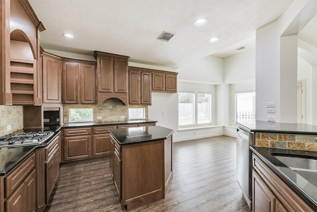 22011 Twinkle Sky Ct, Cypress, TX 77433 - kitchen with dark countertops, open shelves, stainless steel appliances, dark wood-type flooring, and recessed lighting