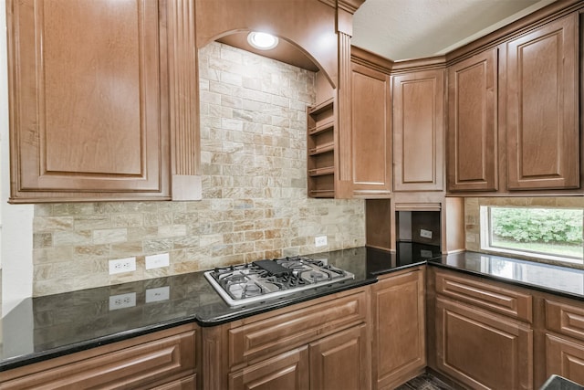 22011 Twinkle Sky Ct, Cypress, TX 77433 - kitchen featuring backsplash, stovetop with downdraft, and dark stone counters
