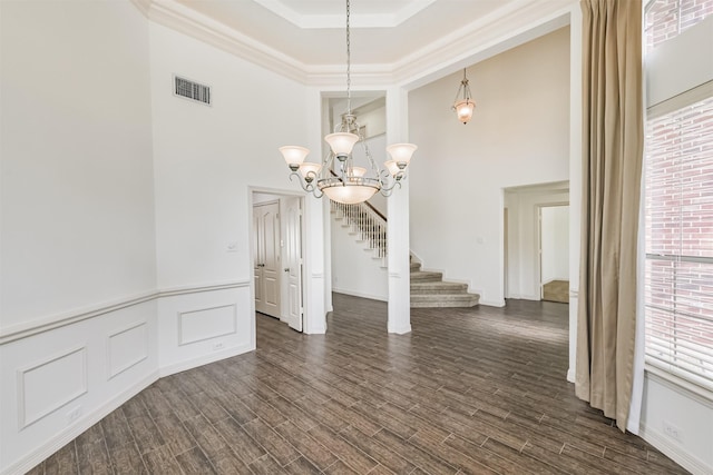 22011 Twinkle Sky Ct, Cypress, TX 77433 - unfurnished dining area with a high ceiling, a chandelier, stairway, plenty of natural light, and dark wood-type flooring