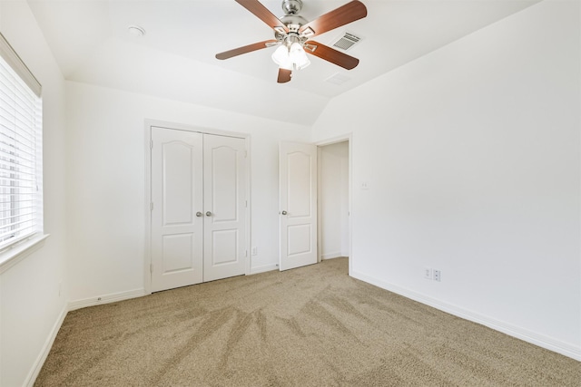 22011 Twinkle Sky Ct, Cypress, TX 77433 - unfurnished bedroom featuring carpet, multiple windows, baseboards, a closet, and vaulted ceiling