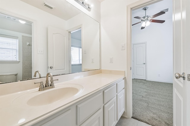 22011 Twinkle Sky Ct, Cypress, TX 77433 - full bath featuring plenty of natural light, vanity, ceiling fan, and toilet