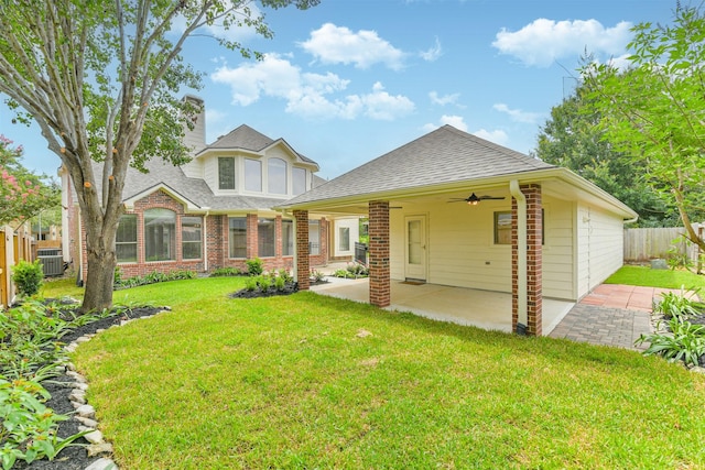 22011 Twinkle Sky Ct, Cypress, TX 77433 - rear view of property with a ceiling fan, a patio, a shingled roof, and brick siding