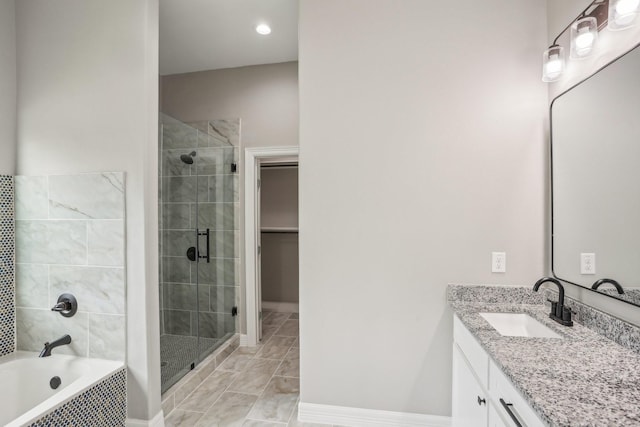 2407 Juliet St, Pasadena, TX 77502 - bathroom with vanity, a shower stall, a garden tub, a walk in closet, and marble finish floors