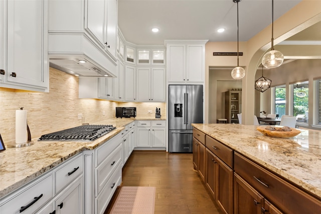 6207 Emerald Bay Point Ln, Houston, TX 77365 - kitchen featuring high end fridge, gas stovetop, white cabinetry, hanging light fixtures, and recessed lighting