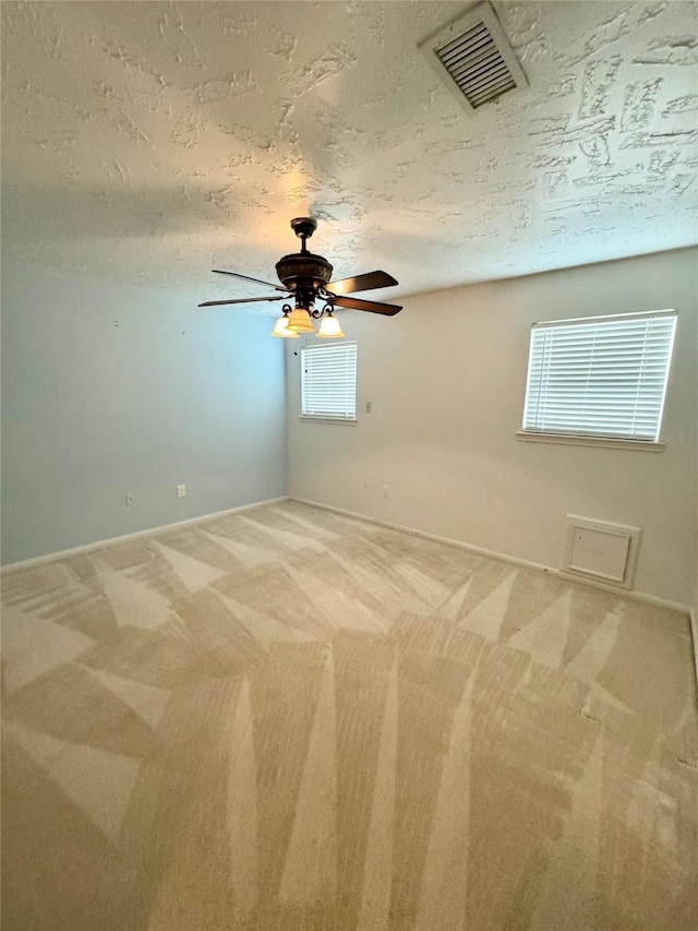 28811 Enchanted Dr, Shenandoah, TX 77381 - carpeted empty room with a textured ceiling, ceiling fan, and baseboards