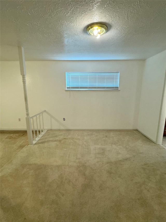 28811 Enchanted Dr, Shenandoah, TX 77381 - unfurnished room with carpet, healthy amount of natural light, and a textured ceiling
