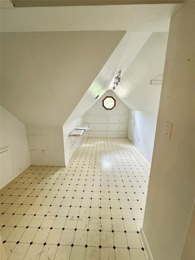 28811 Enchanted Dr, Shenandoah, TX 77381 - bonus room with vaulted ceiling, baseboards, and tile patterned floors