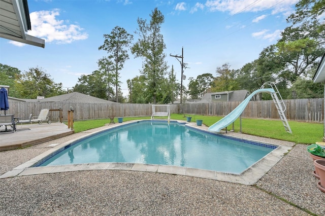 28811 Enchanted Dr, Shenandoah, TX 77381 - view of swimming pool with a water slide, a deck, and a playground