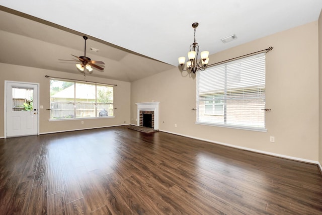 7115 Blanco Pines Dr, Humble, TX 77346 - unfurnished living room featuring lofted ceiling, dark wood finished floors, a chandelier, a ceiling fan, and baseboards