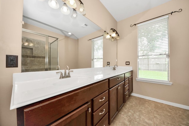 7115 Blanco Pines Dr, Humble, TX 77346 - full bath with double vanity, a tile shower, baseboards, and tile patterned flooring